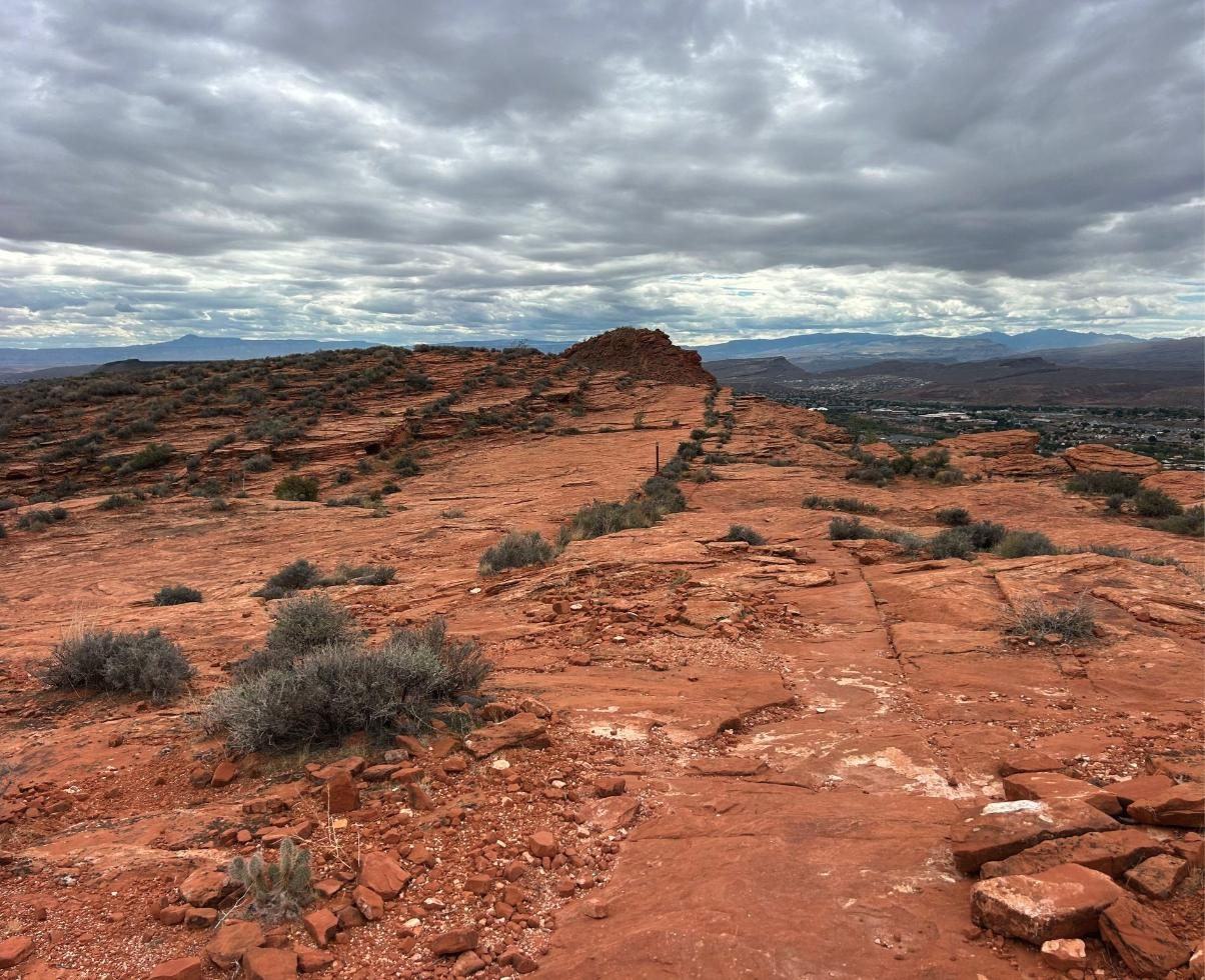 Slickrock ridge with St. George in the distance
